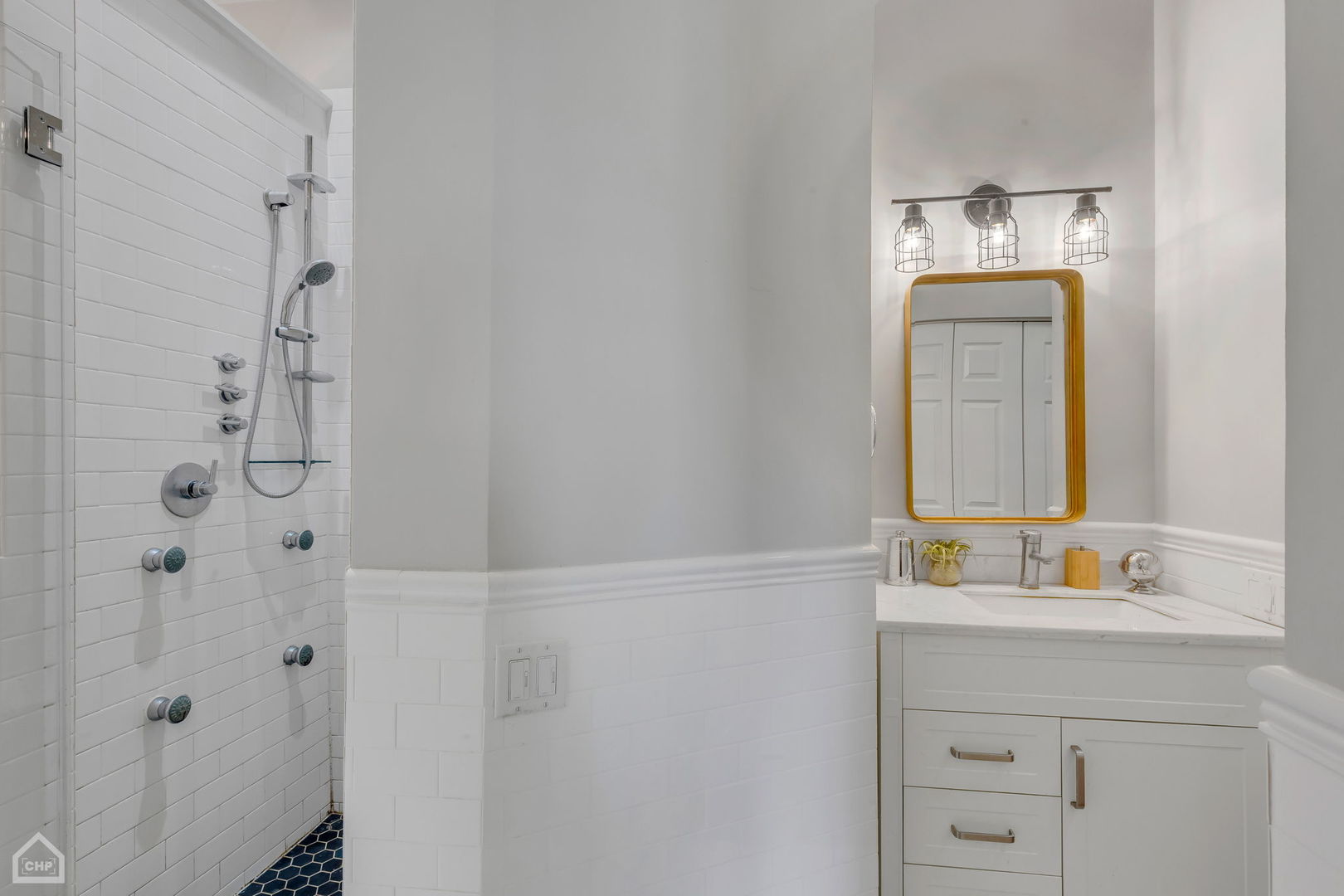 1001 West Altgeld Street, Unit 3 Chicago, IL 60614 - Photo 13 of 18 a bathroom with a sink and a mirror