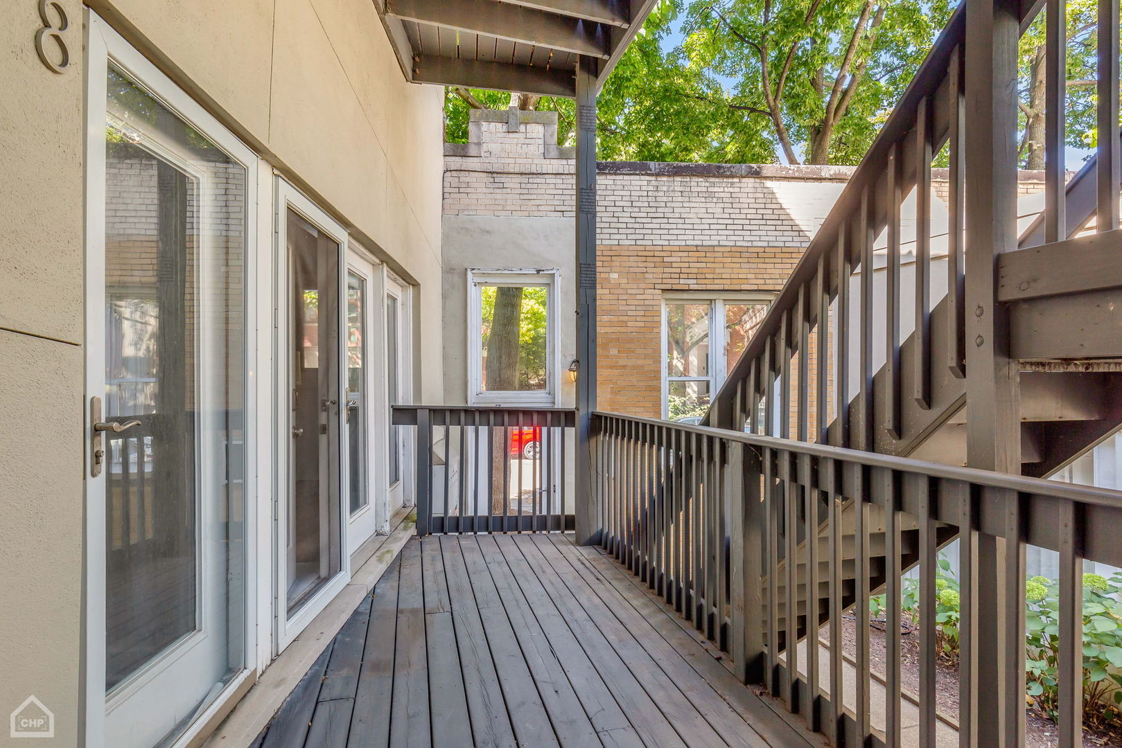 1001 West Altgeld Street, Unit 3 Chicago, IL 60614 - Photo 17 of 18 a view of staircase with wooden floor and wooden fence