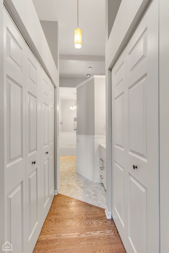 1001 West Altgeld Street, Unit 3 Chicago, IL 60614 - Photo 10 of 18 a view of a hallway with wooden floor and staircase