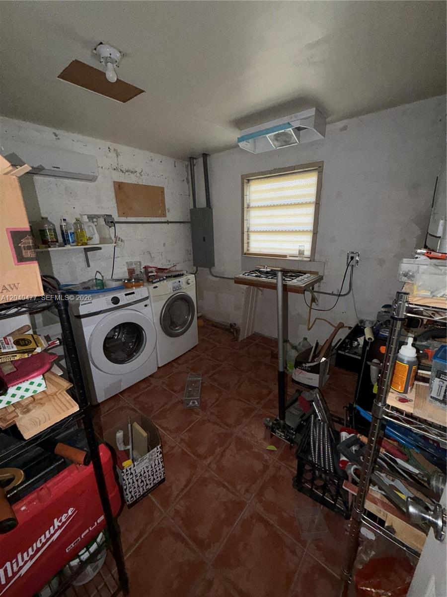 9110 Southwest 44th Street Miami, FL 33165 - Photo 12 of 18 a storage and utility room with musical instruments