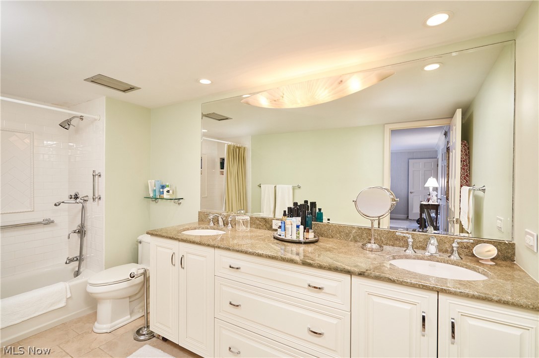 2385 Covington Road, Unit 304 Fairlawn, OH 44313 - Photo 14 of 21 Full bathroom with shower / tub combo, double vanity, light tile patterned floors, and recessed lighting