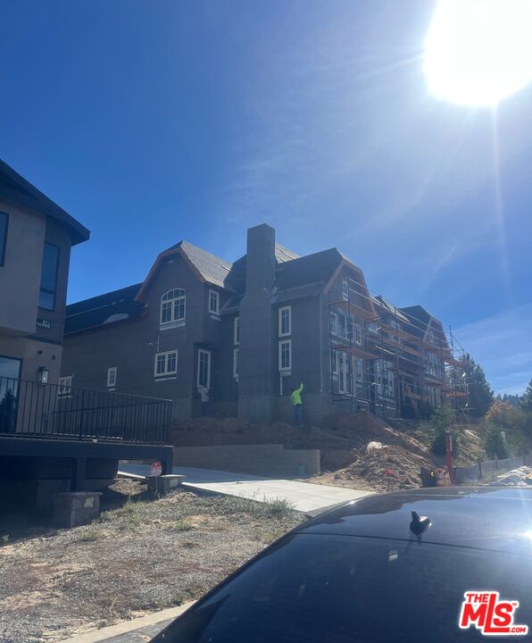 196 Mill Pond Road Lake Arrowhead, CA 92352 - Photo 23 of 36 a front view of a house with a yard