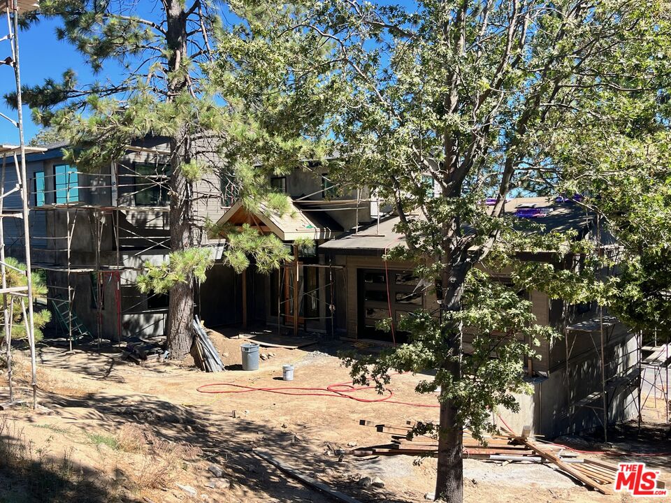 196 Mill Pond Road Lake Arrowhead, CA 92352 - Photo 29 of 36 a view of a house with snow on the road