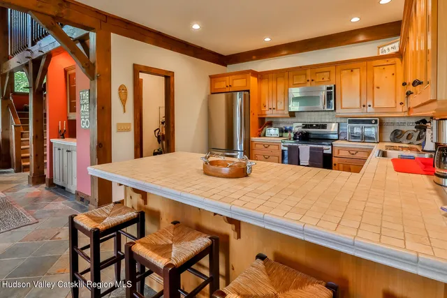 a kitchen with stainless steel appliances granite countertop a sink and cabinets