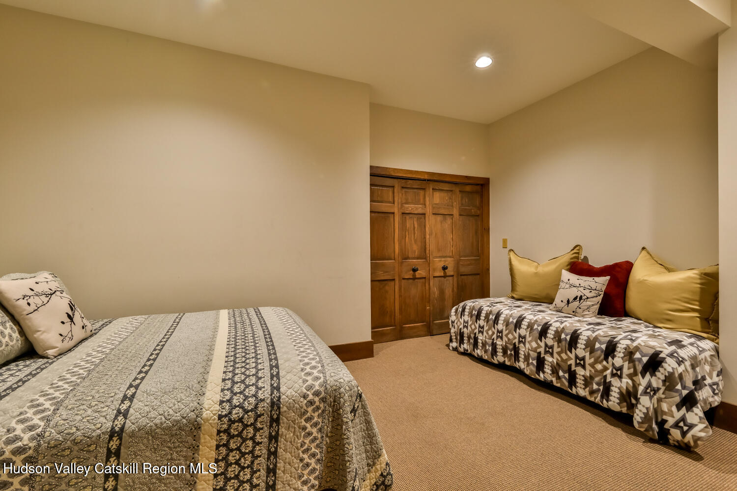 2 Watch Hill Lane, Unit 2 Windham, NY 12496 - Photo 31 of 41 a bedroom with a bed and a couch