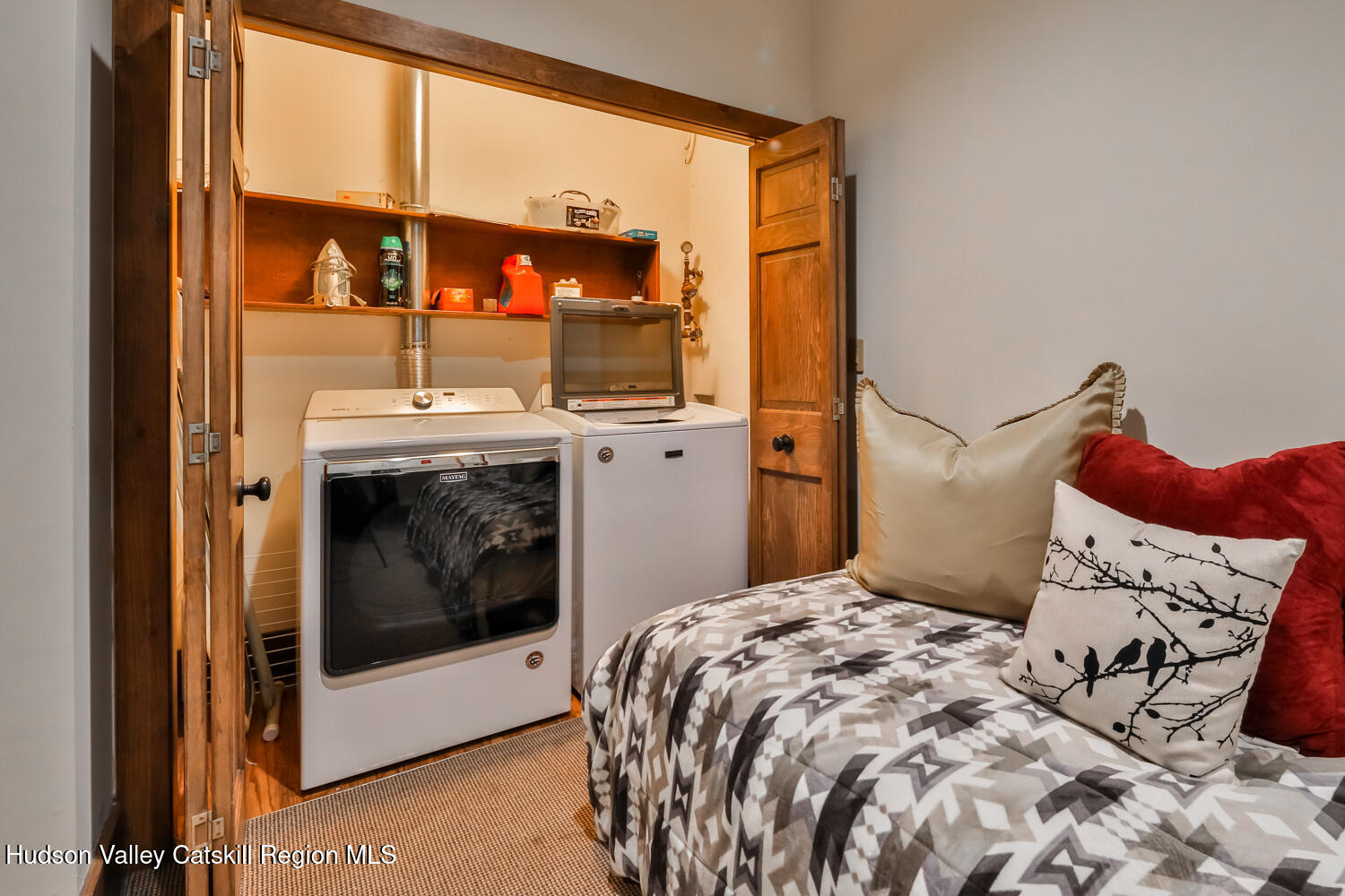 2 Watch Hill Lane, Unit 2 Windham, NY 12496 - Photo 32 of 41 a bedroom with a bed and a mirror