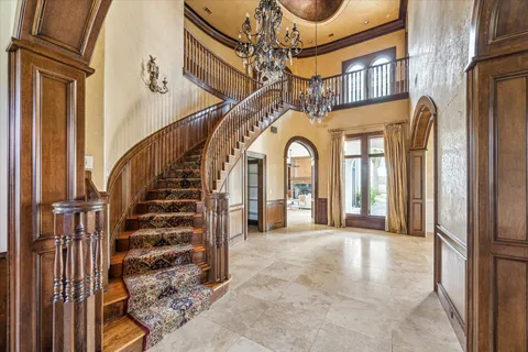 a view of entryway and hall with a front door