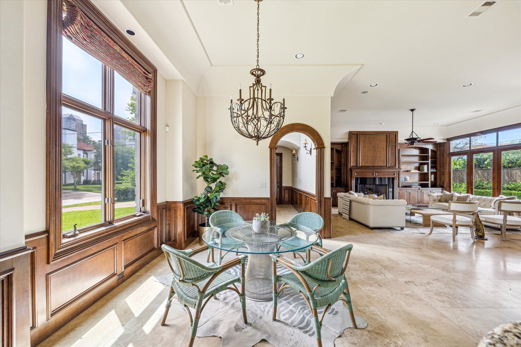 5303 Longmont Drive Houston, TX 77056 - Photo 22 of 50 a dining room with furniture a chandelier and wooden floor