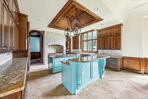 a view of a kitchen with a sink and cabinets