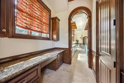 a kitchen with stainless steel appliances granite countertop a stove and a window