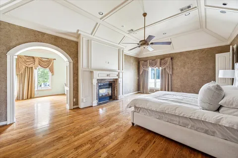 a bedroom with a bed and a fireplace