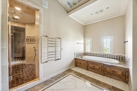 a view of bedroom with furniture and windows