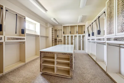 a view of kitchen with cabinets and wooden floor