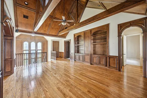 a view of an entryway with wooden floor