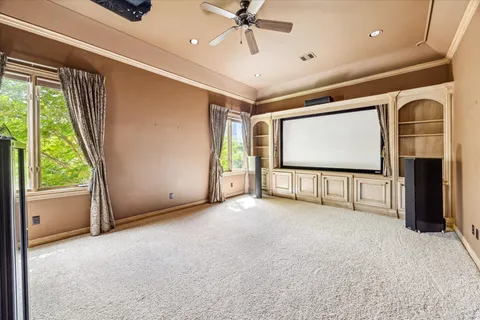 a view of a livingroom with an empty space and a window