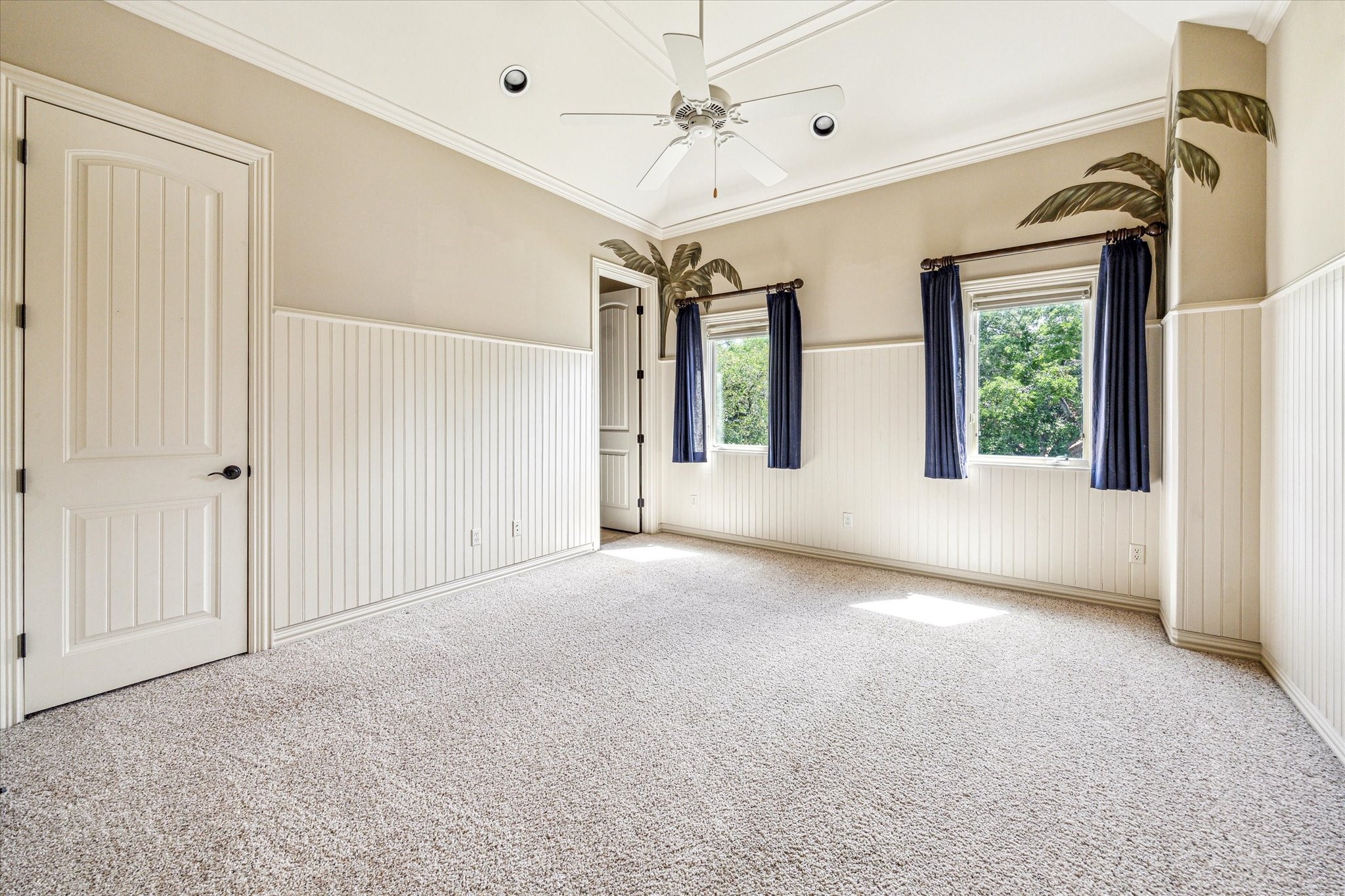 5303 Longmont Drive Houston, TX 77056 - Photo 43 of 50 a view of a big room with windows and chandelier fan