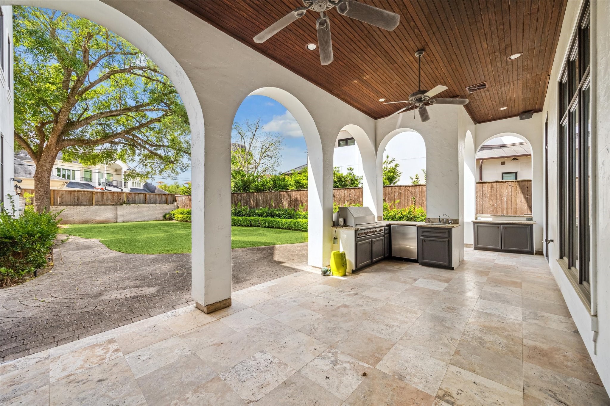 5303 Longmont Drive Houston, TX 77056 - Photo 48 of 50 a view of a hall with a couch and wooden fence