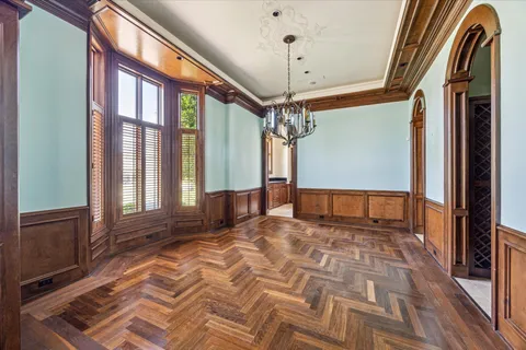 a view of a hallway with a chandelier