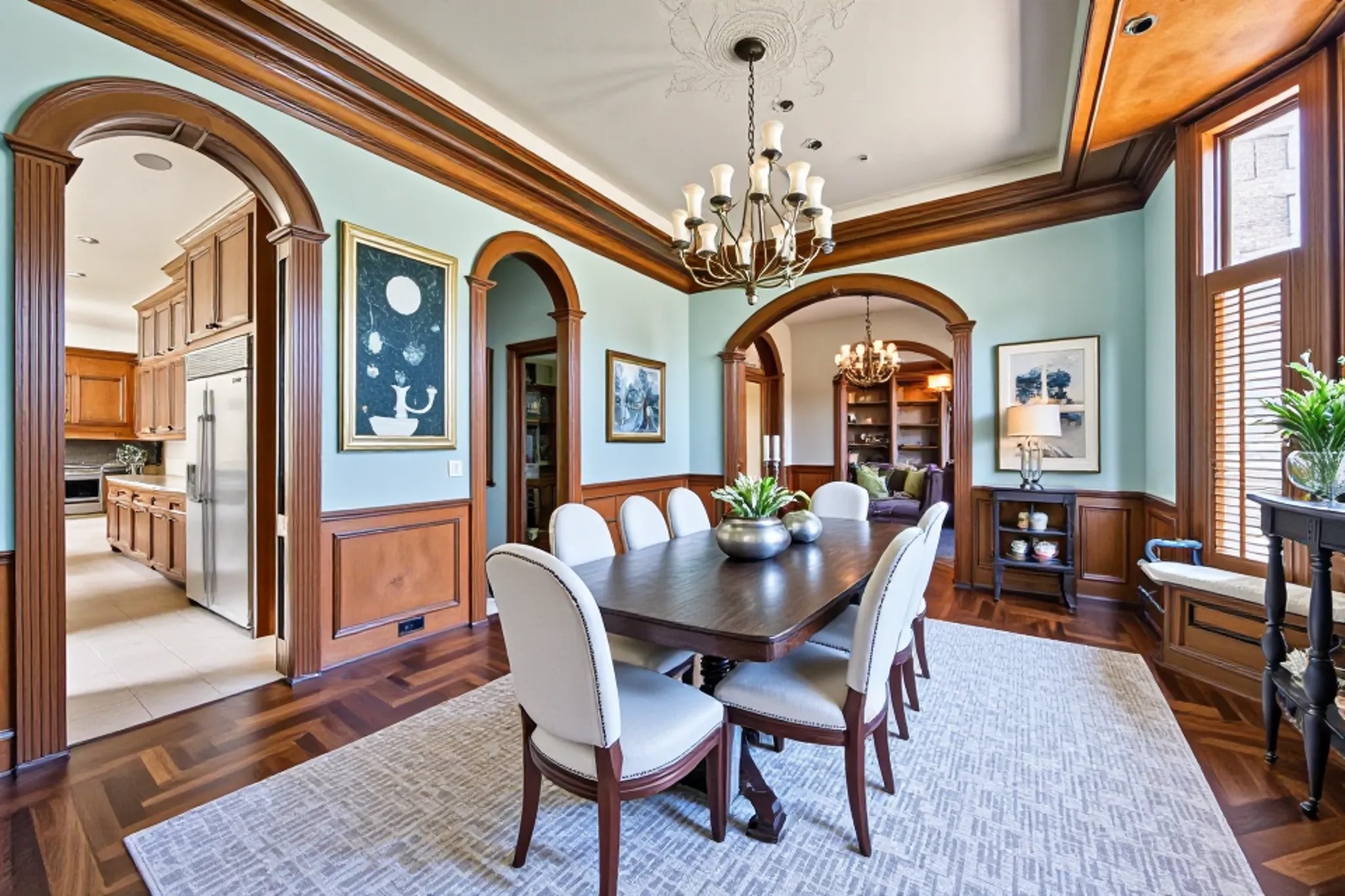 5303 Longmont Drive Houston, TX 77056 - Photo 8 of 50 a view of a dining room with furniture a chandelier and wooden floor