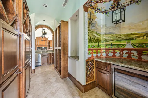 a view of a kitchen with stainless steel appliances granite countertop a refrigerator and a sink