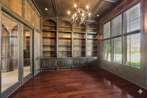 a view of a room with windows and chandelier