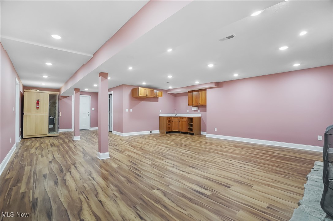 1094 San Raphael Drive Akron, OH 44333 - Photo 37 of 50 Unfurnished living room with recessed lighting and light wood-style floors