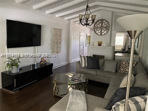 2221 Southwest 26th Lane Miami, FL 33133 - Photo 9 of 13 a living room with furniture and a flat screen tv