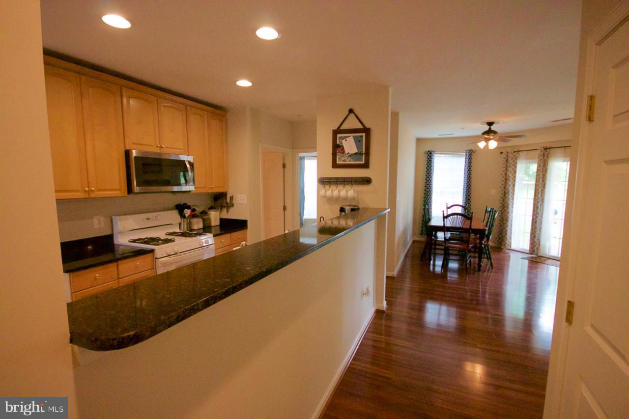 25252 Riffleford Square, Unit 101 Chantilly, VA 20152 - Photo 2 of 30 a view of a living room and dining room
