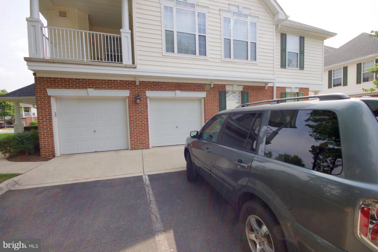 25252 Riffleford Square, Unit 101 Chantilly, VA 20152 - Photo 24 of 30 a view of building with car parked