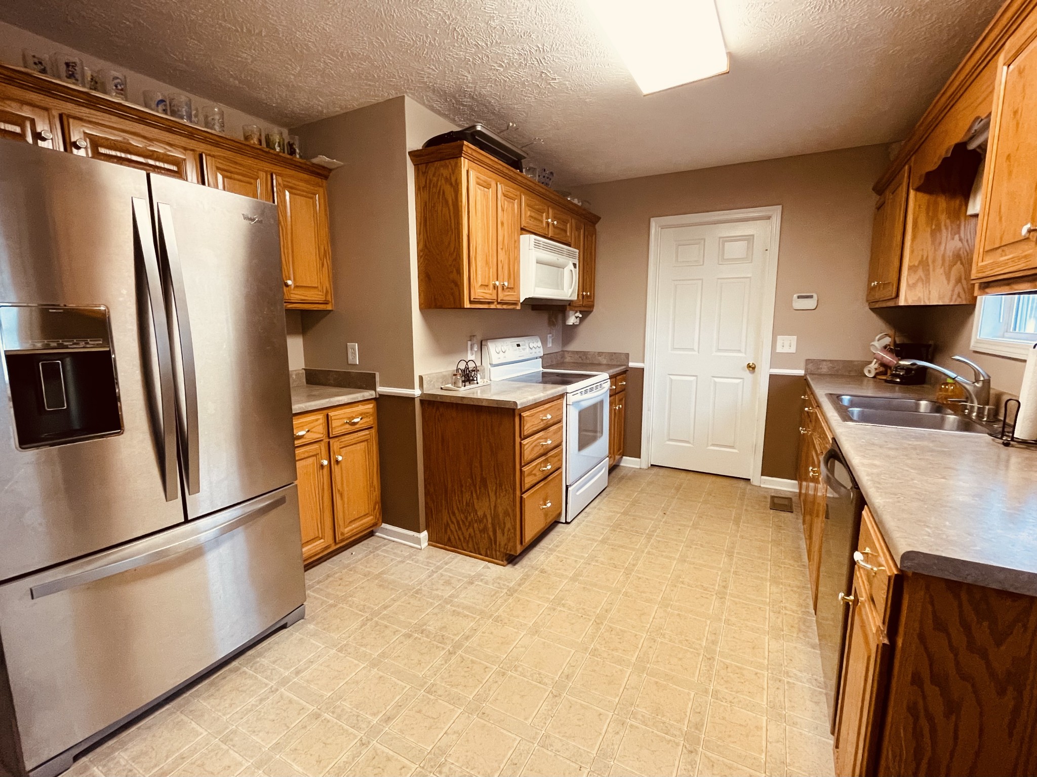 2948 Riley Creek Road Normandy, TN 37360 - Photo 12 of 28 a kitchen with stainless steel appliances granite countertop a refrigerator a stove a sink and a refrigerator
