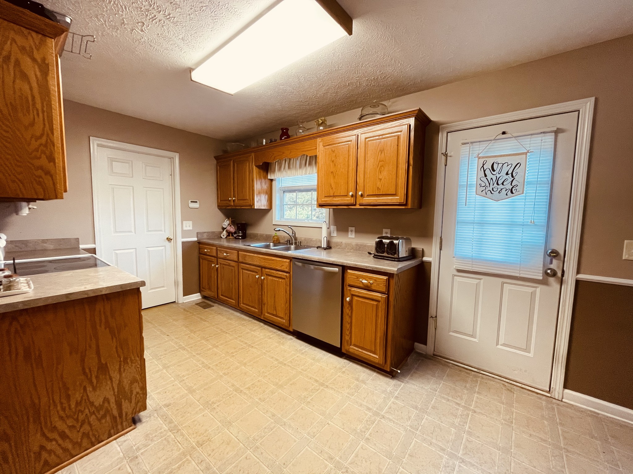 2948 Riley Creek Road Normandy, TN 37360 - Photo 13 of 28 a kitchen with a sink a stove and a refrigerator