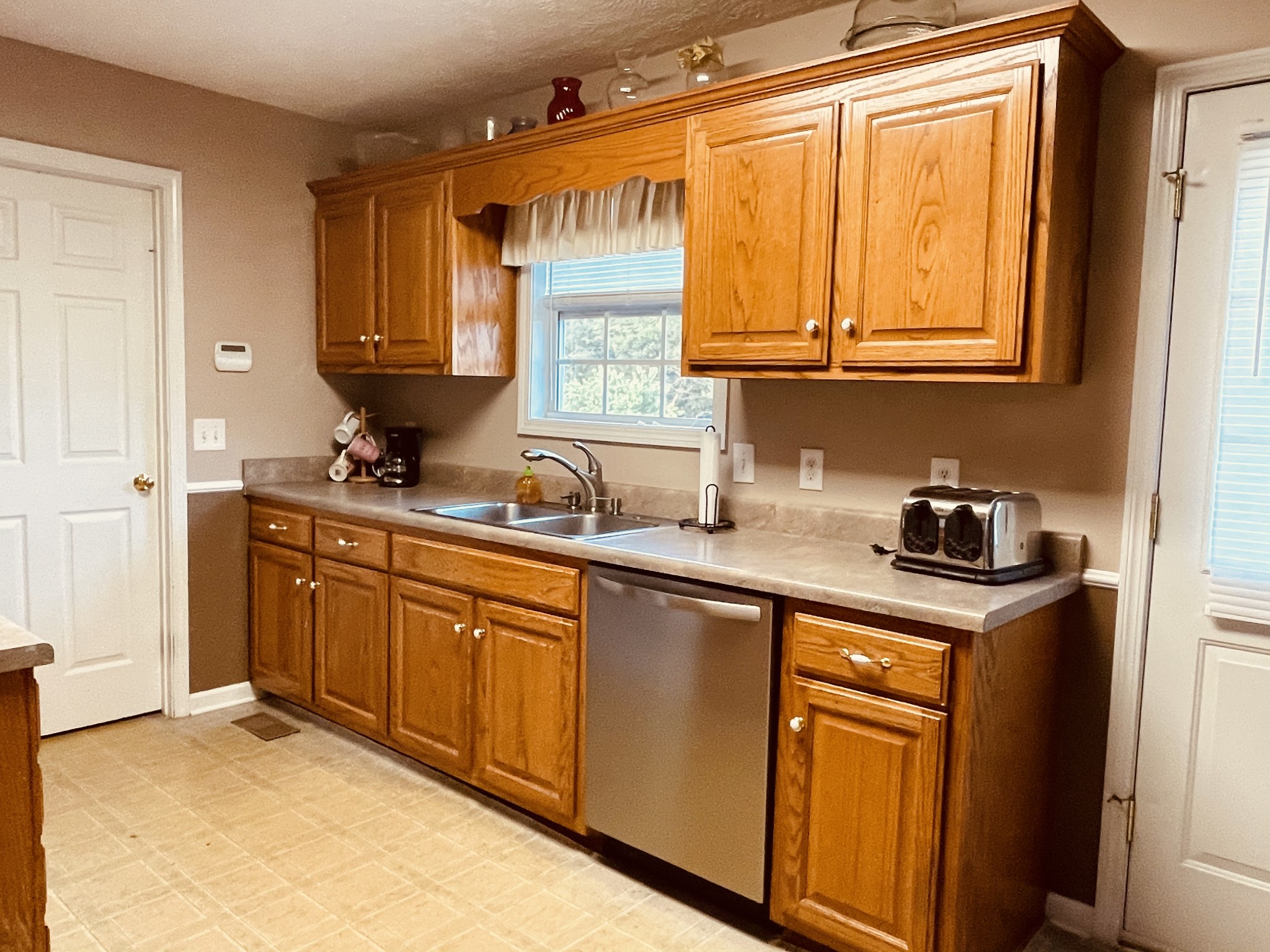 2948 Riley Creek Road Normandy, TN 37360 - Photo 15 of 28 a kitchen with stainless steel appliances granite countertop a sink stove and cabinets