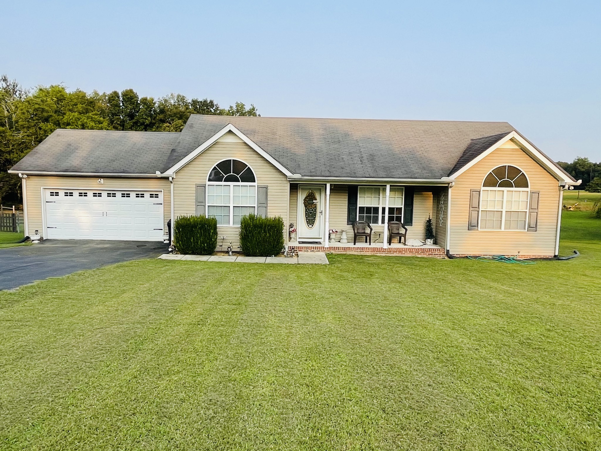 2948 Riley Creek Road Normandy, TN 37360 - Photo 4 of 28 a front view of a house with a garden and yard