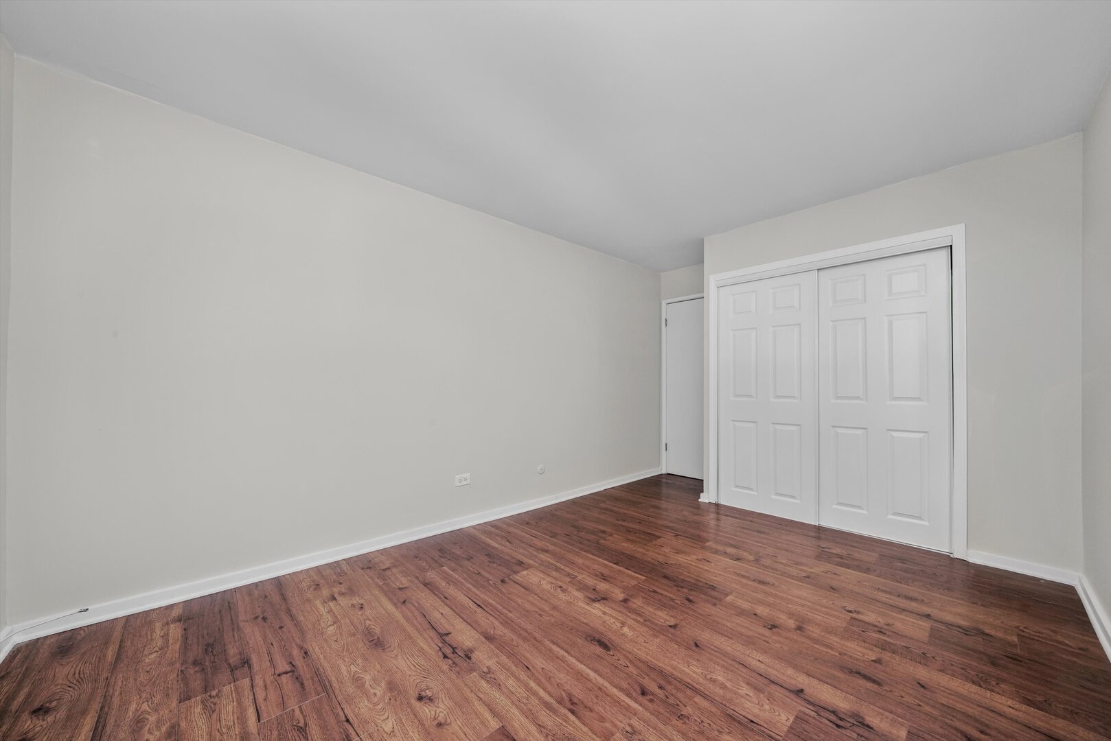 3617 Central Avenue East, Unit 201 Glenview, IL 60025 - Photo 13 of 21 a view of an empty room with wooden floor