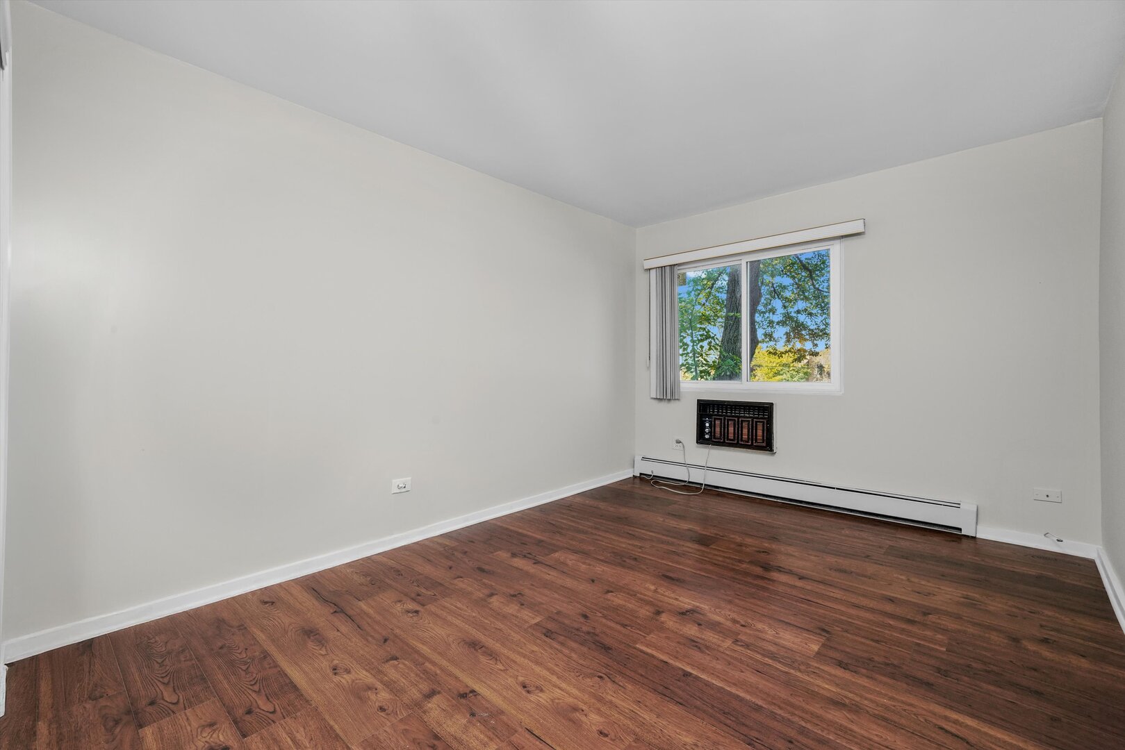 3617 Central Avenue East, Unit 201 Glenview, IL 60025 - Photo 15 of 21 wooden floor in an empty room with a window