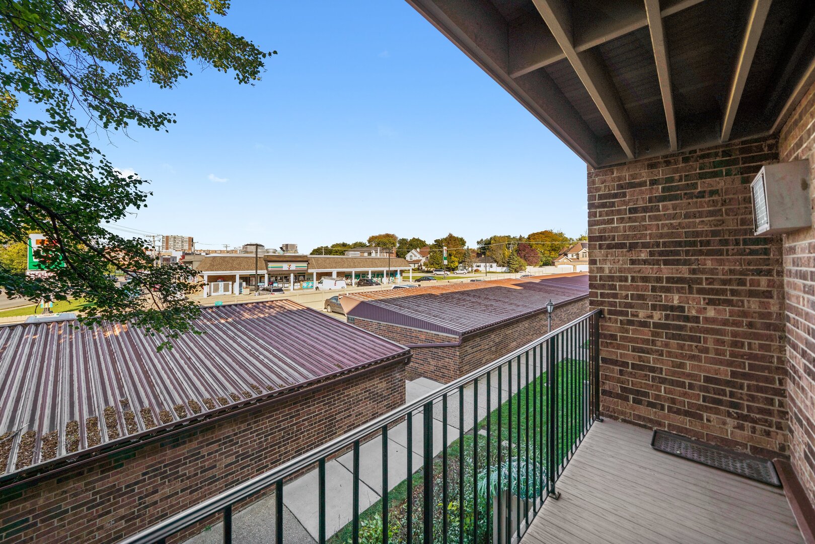 3617 Central Avenue East, Unit 201 Glenview, IL 60025 - Photo 3 of 21 a view of a balcony with wooden floor and city view