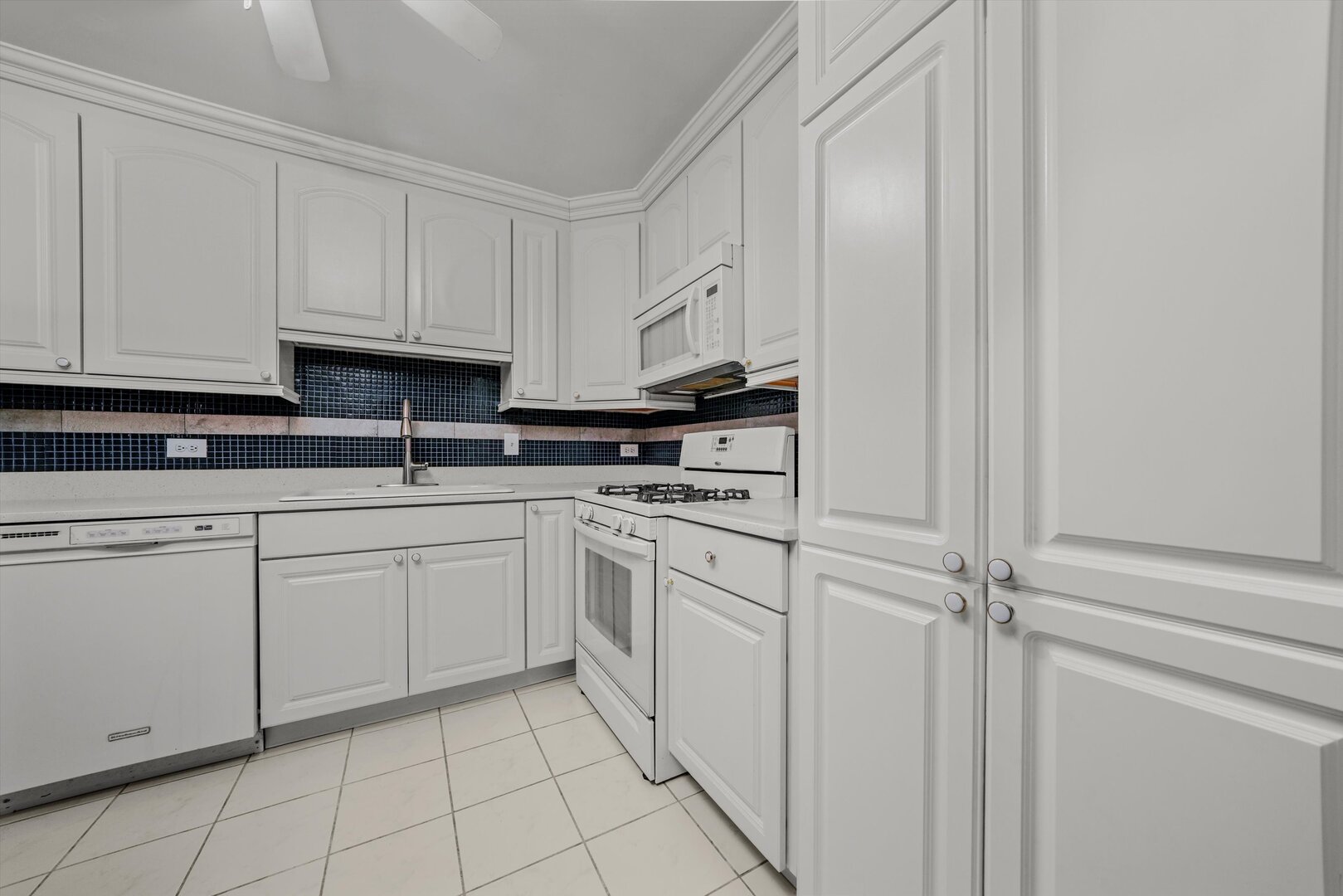 3617 Central Avenue East, Unit 201 Glenview, IL 60025 - Photo 9 of 21 a kitchen with white cabinets and white appliances