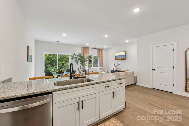 a kitchen with sink and window