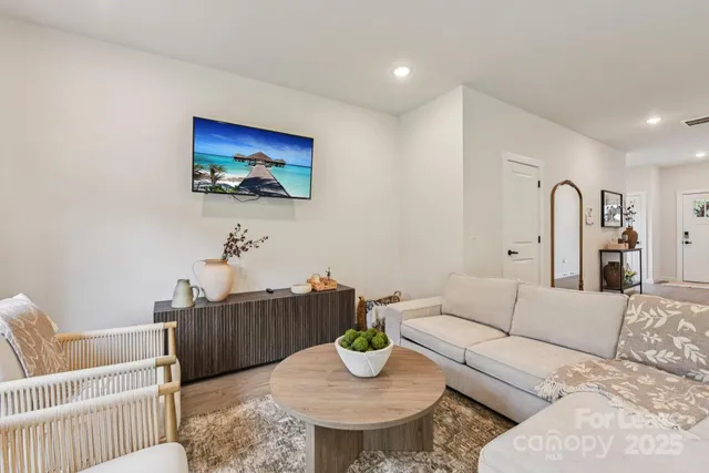 a living room with furniture and a rug