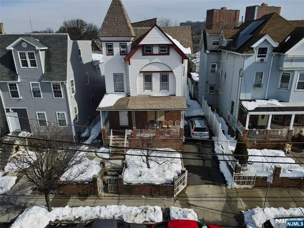 a front view of a houses with yard
