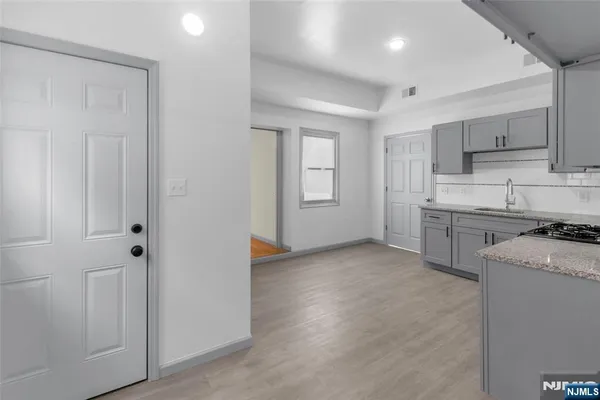 a view of a kitchen with electric appliances