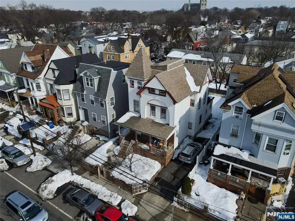 an aerial view of a house with seating space