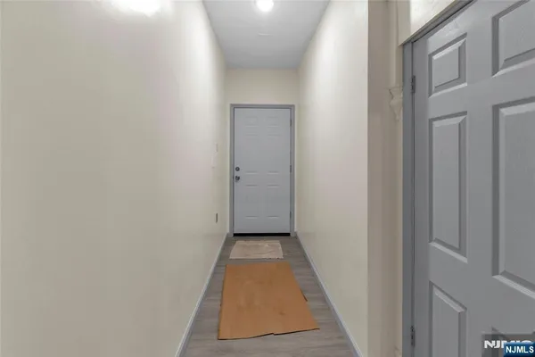 a view of a hallway with a white door