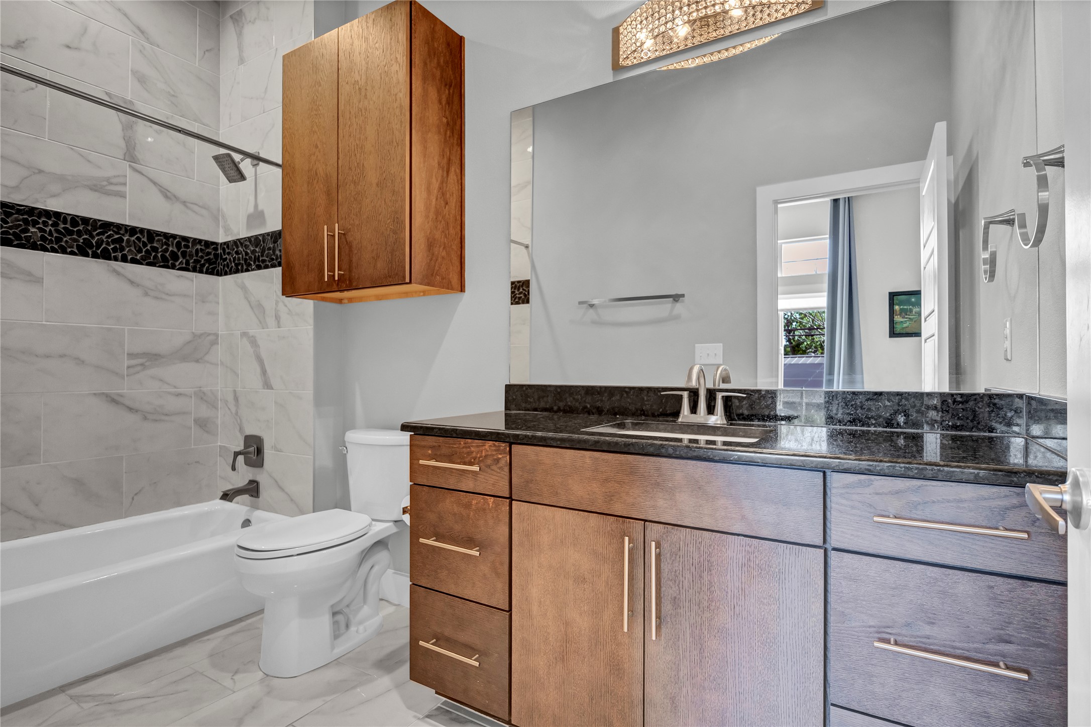 3504 Clawson Road, Unit 7 Austin, TX 78704 - Photo 13 of 26 Full bathroom featuring tub / shower combination, vanity, and light marble finish flooring