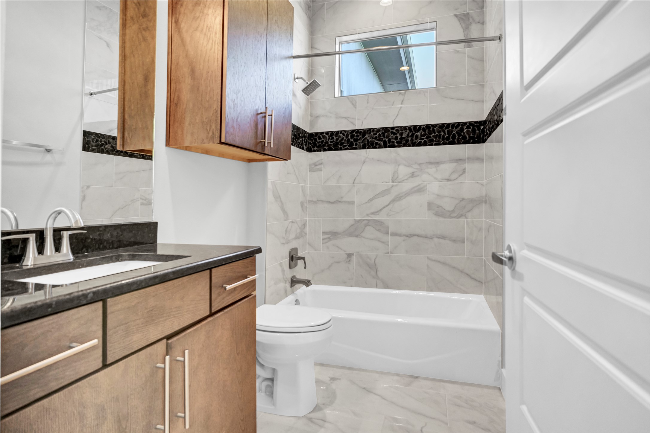 3504 Clawson Road, Unit 7 Austin, TX 78704 - Photo 15 of 26 Full bath featuring shower / washtub combination, vanity, and light marble finish floors