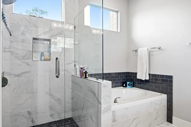 a bathroom with a bathtub and a sink
