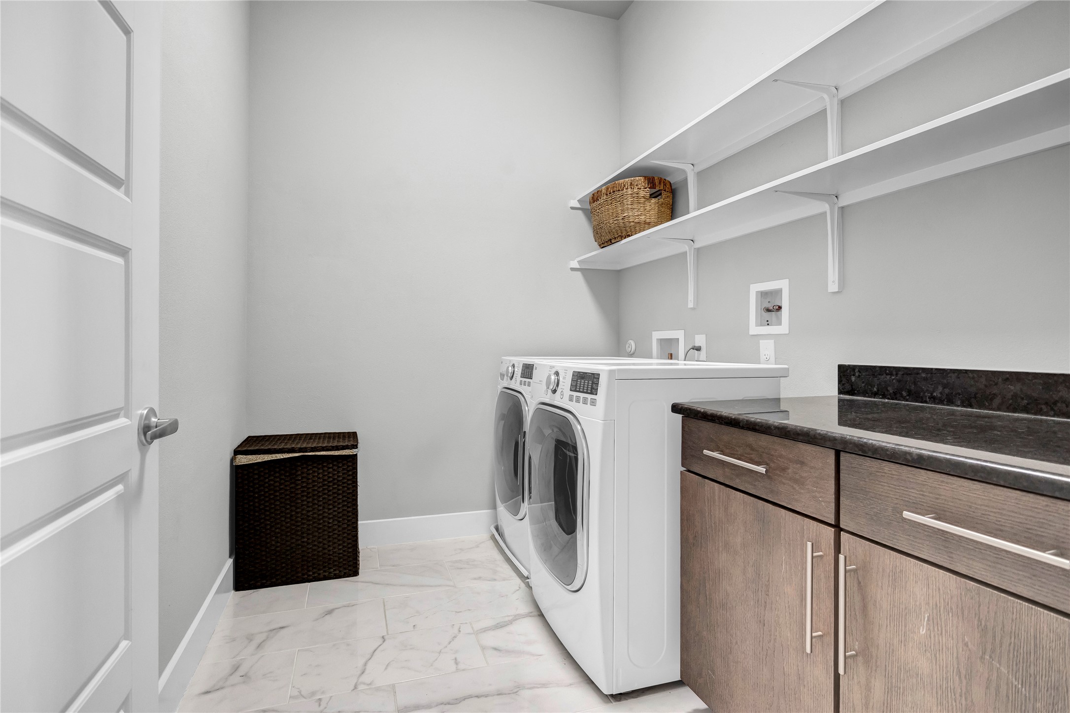 3504 Clawson Road, Unit 7 Austin, TX 78704 - Photo 16 of 26 Laundry area featuring light marble finish flooring, washing machine and dryer, and cabinet space