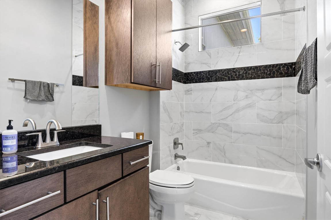 3504 Clawson Road, Unit 7 Austin, TX 78704 - Photo 20 of 26 a bathroom with a sink toilet and shower