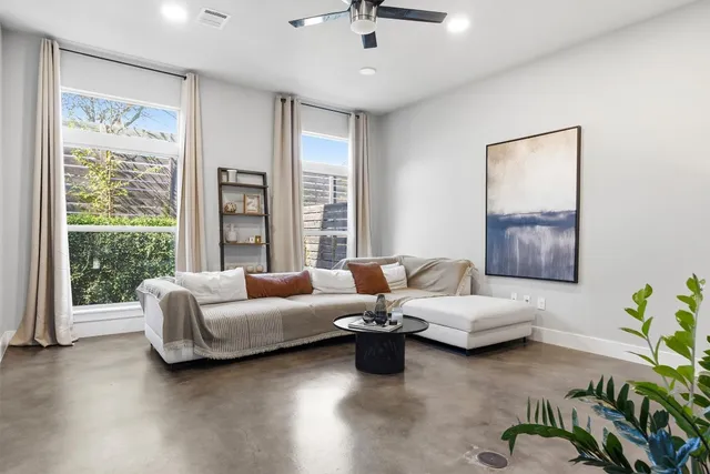 a living room with furniture and a window