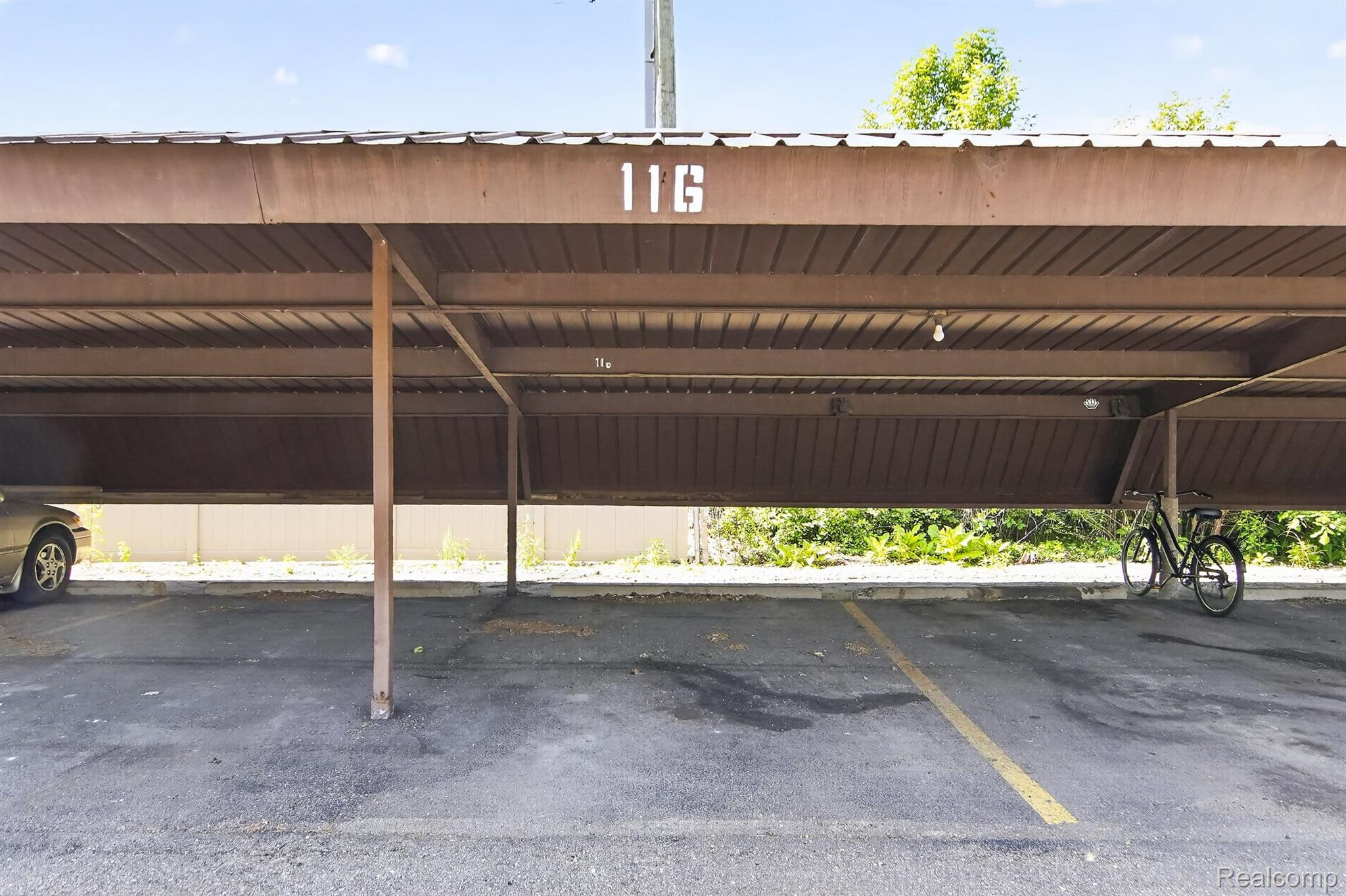 24111 Meridian Road, Unit 116 Grosse Ile, MI 48138 - Photo 26 of 26 Covered parking structure with designated parking space 11G